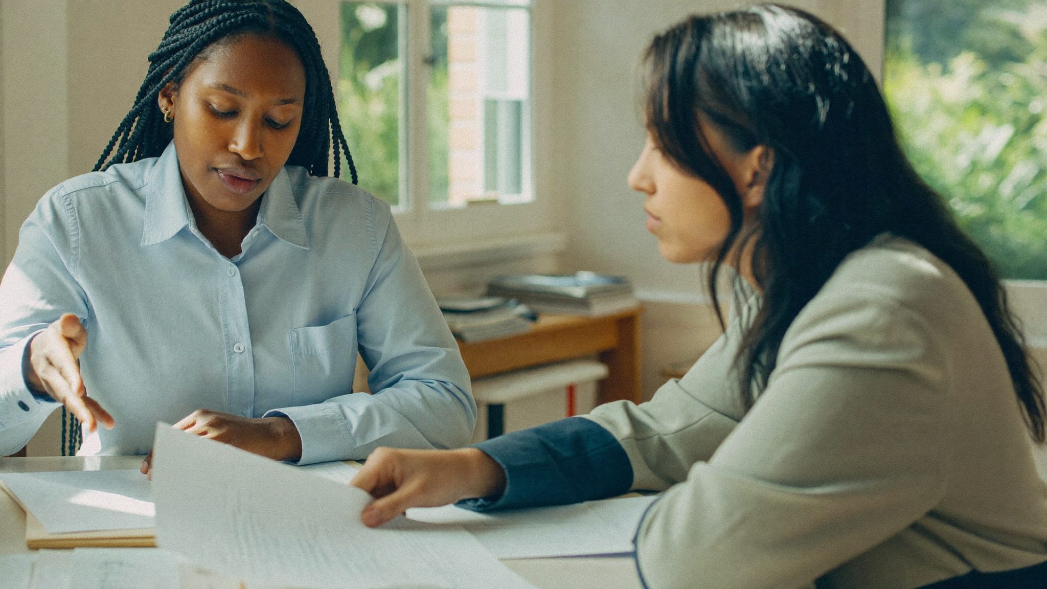 A consultation meeting moment between adviser and client at Arvellos