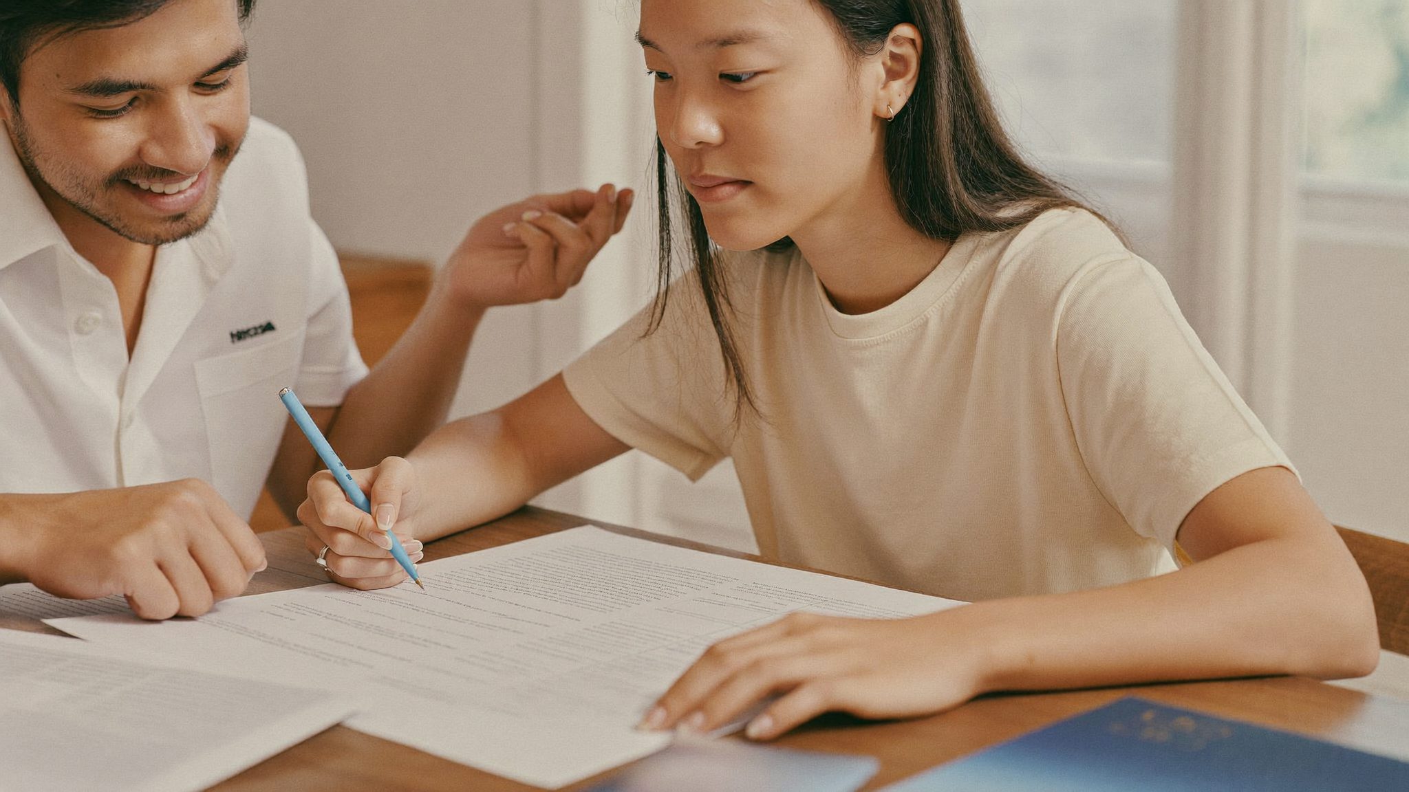 A young family reviewing their financial plan together at home